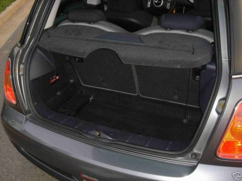 2003 MINI Cooper - The cargo area of a 2003 MINI Cooper is shown, with the rear seats folded down for extra space.