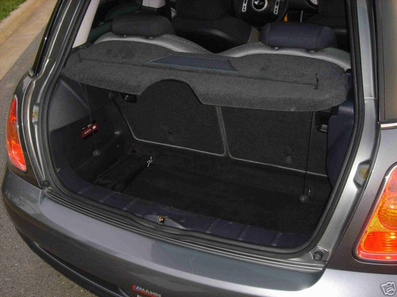 Trunk of a 2003 MINI Cooper, showing the cargo area and rear seats folded down