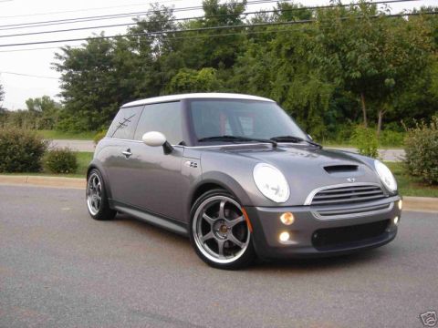 2003 MINI Cooper - Gray 2003 MINI Cooper S, front 3/4 view, parked outdoors with trees in background.