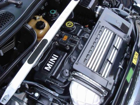 2003 MINI Cooper - The engine bay of a 2003 MINI Cooper is visible, the engine cover and intercooler.