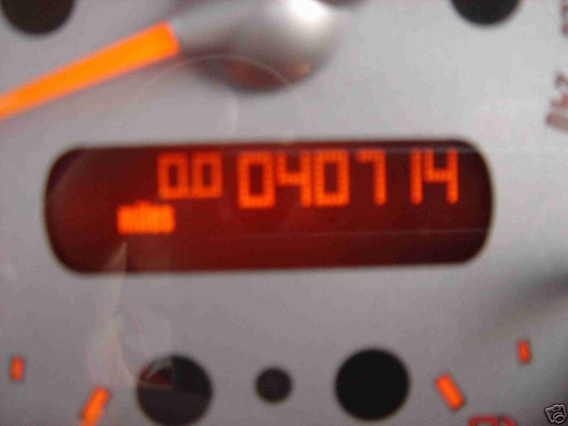 Digital odometer reading 040714 miles on white gauge cluster