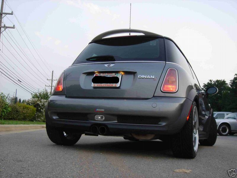 Rear of gray MINI Cooper with DINAN badge and dual center exhaust