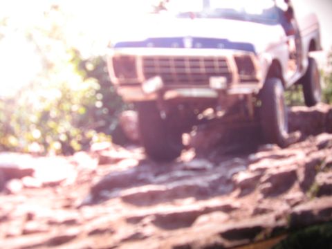 1979 Ford Bronco - This 1978 Ford Bronco navigates a challenging rocky path with its driver's door ajar.