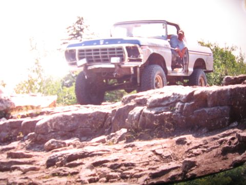 1979 Ford Bronco - A 1979 Ford Bronco navigates a rocky terrain.