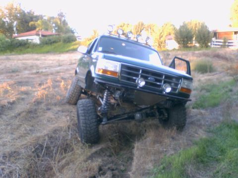 1996 Ford Bronco - This 1996 Ford Bronco is shown navigating a steep, grassy incline.