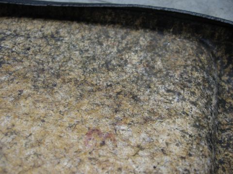 1974 Ford F-100 - Interior view of a car's trunk liner, showing the textured material and dark trim.