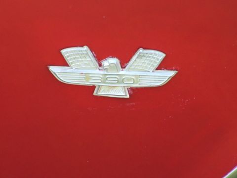 1966 Ford Ranchero - Close-up of a 390 engine displacement badge, likely from a Ford vehicle.