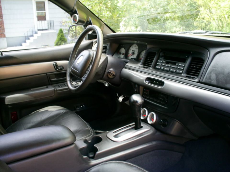 2003 Mercury Marauder interior showing dashboard, steering wheel, shifter, and gauges