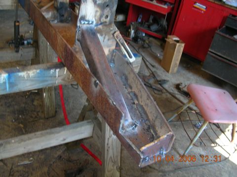 1991 Ford F-150 - Close-up of a rusted metal frame section undergoing repair or fabrication.