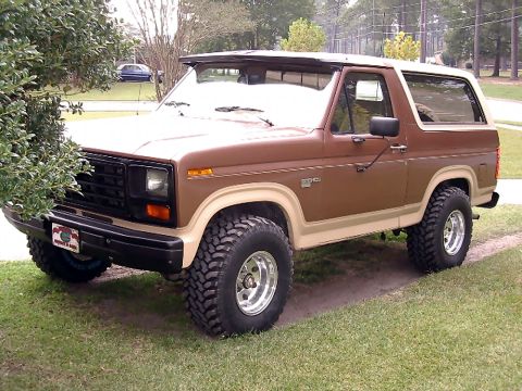 1985 Ford Bronco - This 1985 Ford Bronco is shown in a three-quarter front view, parked outdoors.
