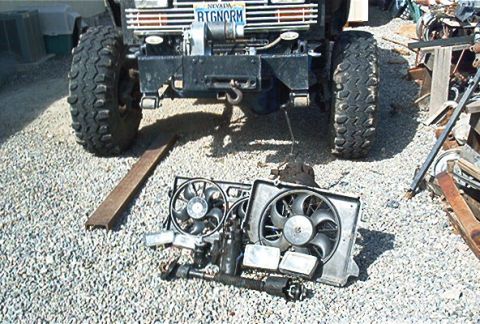 1986 Ford Bronco - A 1986 Ford Bronco is shown from the front, equipped with a winch and oversized off-road tires.