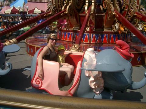 1995 Ford Bronco - A woman and child enjoy a ride on Dumbo the Flying Elephant at Disneyworld.