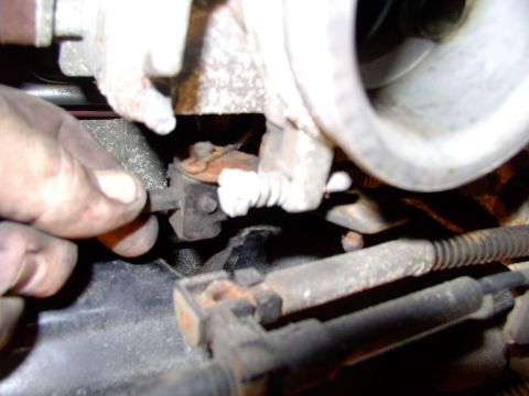 1990 Lincoln Town Car - Pull off the clip over the TV cable linkage next