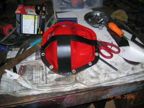 1985 Ford Bronco - Differential cover on a workbench with various tools and a newspaper dated 10.06.2006.