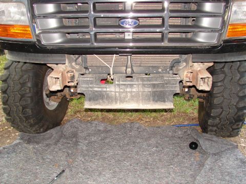 1996 Ford Bronco - Front view of a 1996 Ford Bronco showing tow hooks and grille.