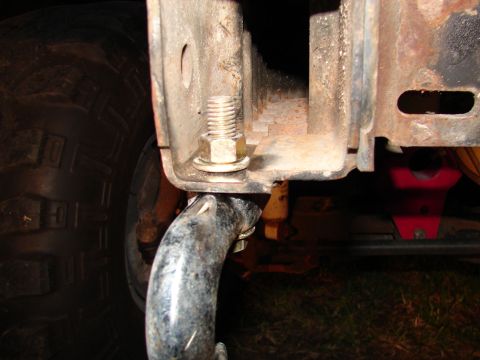 1996 Ford Bronco - Close-up of a tow hook and vehicle frame, with a tire visible.