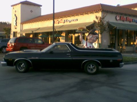 1973 Ford Ranchero - This black Ford Ranchero, likely a 1972 model, is seen parked with a Bob's Big Boy mascot in its bed.