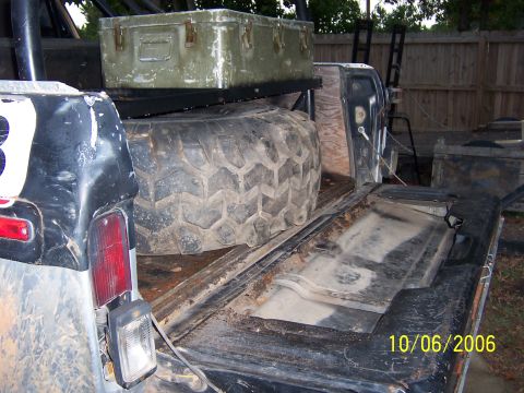1978 Ford Bronco - Built a rack to hold my storage box and a cooler. had to cut the inside of the tailgate to cleat the tire.