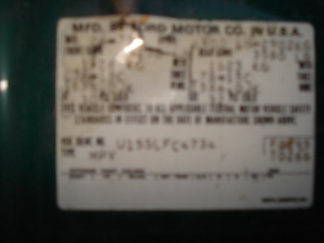 Faded Ford Motor Co. certification label on green paint, type MPV, most figures unreadable