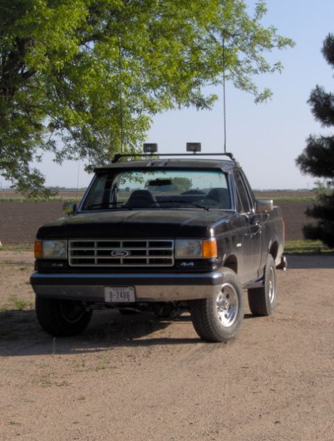 1987 Ford Bronco - 1987 Ford Bronco with roof rack and auxiliary lights.