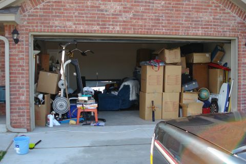 1994 Ford Bronco - The garage is full of stored items and household goods.