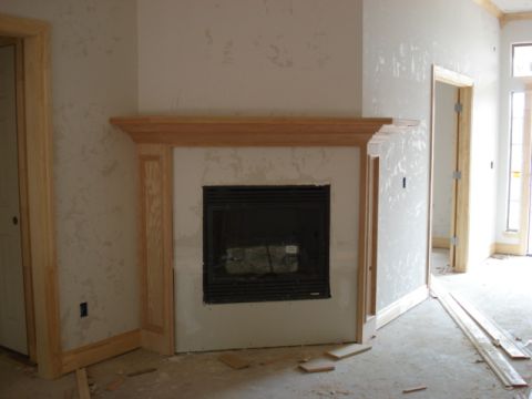 1994 Ford Bronco - Interior view of a room under construction, a fireplace and doorways.