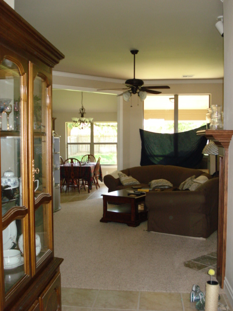 1994 Ford Bronco - Living and dining area interior with furniture and a ceiling fan.