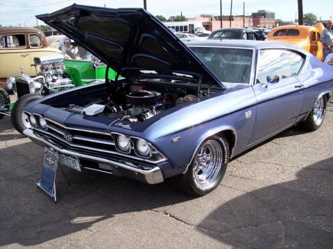 1972 Ford Ranchero - A blue 1969 Chevrolet Chevelle SS coupe is displayed with its hood open, revealing the engine bay.