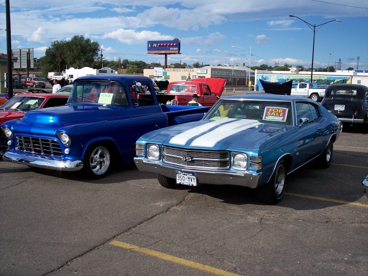 Blue 1970 Chevrolet Chevelle SS coupe with white racing stripes and a "FOR SALE" sign on the windshield