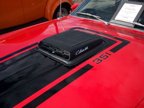 1972 Ford Ranchero - Close-up of a 1972 Ford Ranchero's hood, showing the Cobra Jet scoop and 351 badging.