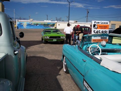 1972 Ford Ranchero - A green muscle car from the 1970s is parked at an outdoor car show.