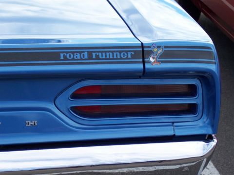 1972 Ford Ranchero - Rear view of a blue car with a 'road runner' decal and horizontal taillights.
