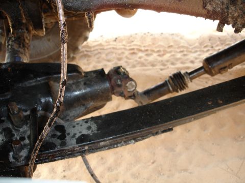 1989 Ford Bronco - Close-up view of the drivetrain components of an unidentified vehicle.