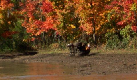 1979 Ford Bronco - ATV stuck in mud during autumn.