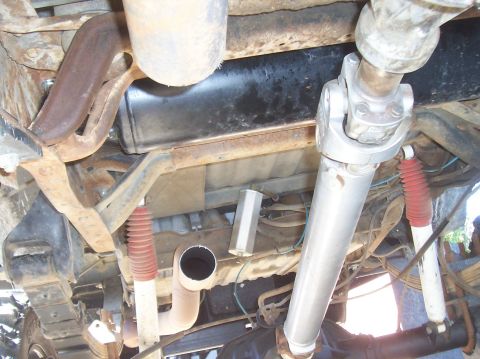 1994 Ford F-150 - Undercarriage view shows exhaust system and driveshaft components of a truck.