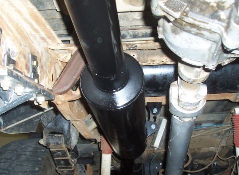 1994 Ford F-150 - Close-up view of the undercarriage, focusing on the exhaust system and drivetrain components.