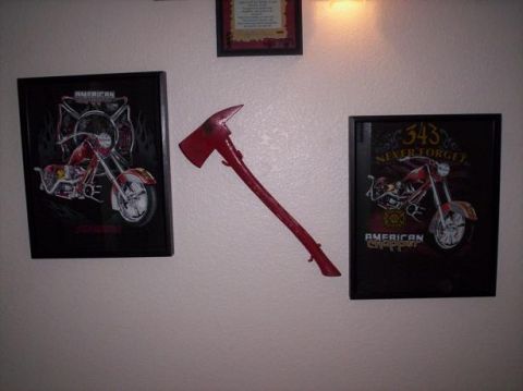 1989 Ford Bronco - Wall decor a firefighter's axe and two framed motorcycle art pieces.