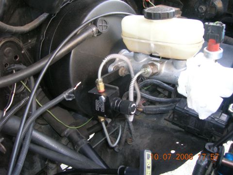 1996 Ford Bronco - Close-up view of the brake system components, including the master cylinder and booster, with a date stamp of 10.07.2006.
