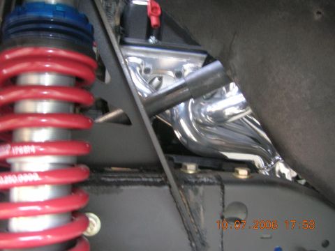 1996 Ford Bronco - Chrome exhaust manifold and suspension components are visible in this close-up shot.