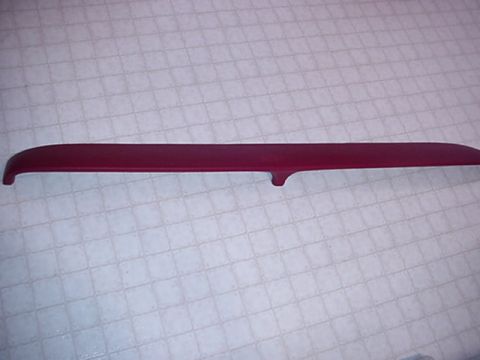 1979 Ford Bronco - A single red trim piece is shown against a textured surface.