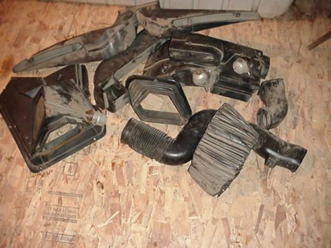 1979 Ford Bronco - Collection of assorted automotive HVAC ducting parts, likely for an older vehicle.