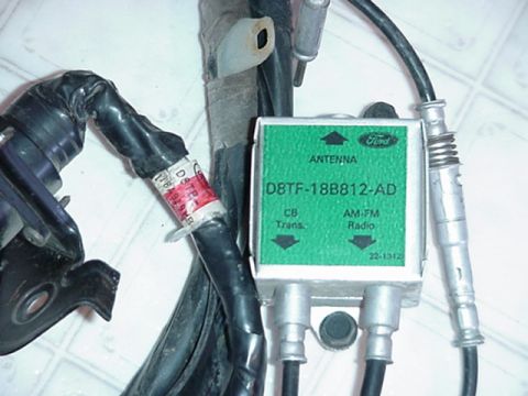 1979 Ford Bronco - Close-up of a Ford antenna module for CB and AM-FM radio, showing part number and wiring.