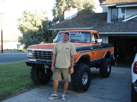 1994 Ford Bronco - This lifted 1979 Ford F-Series pickup truck features a two-tone orange and black paint scheme.