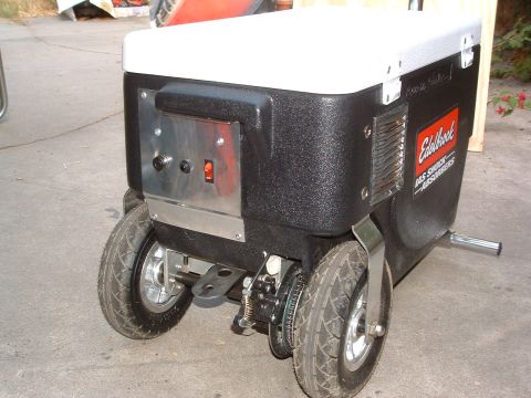 2004 Toyota Tacoma - This cooler has a black body, white lid, and two wheels, with an Edelbrock logo visible.
