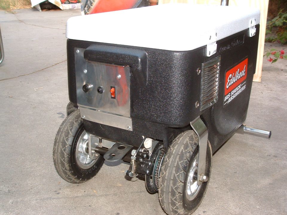 Black cooler with white lid, Edelbrock logo, and two wheels