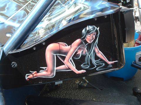 2004 Toyota Tacoma - A custom airbrushed panel displays a devil girl with lightning graphics.