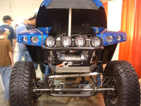 2004 Toyota Tacoma - This modified off-road vehicle has a custom front end with KC lights and a winch, and is not a 2004 Toyota Tacoma.