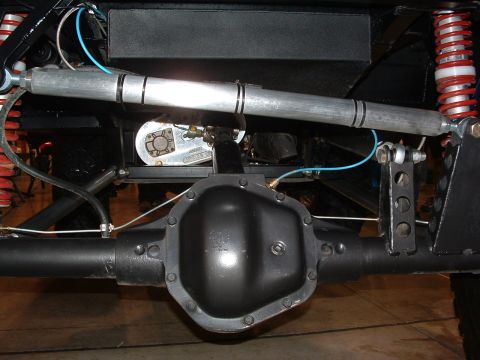 2004 Toyota Tacoma - Close-up view of a vehicle's rear axle assembly, including shocks and stabilizer bar.