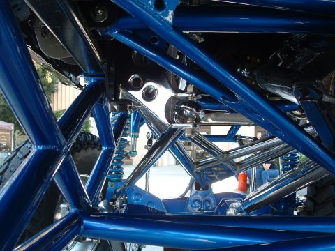 2004 Toyota Tacoma - The intricate blue-painted chassis and suspension system of a custom vehicle are visible.