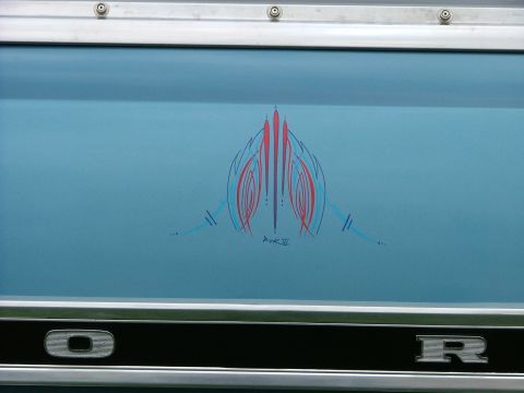 1970 Ford Ranchero - Pinstripe art adorns a blue vehicle panel, with a signature visible at the bottom.